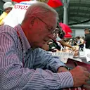 Former Grand Prix driver Phil Hill (USA) signs autographs for fans.
Formula One World Championship, Rd9, United States Grand Prix, Preparations, Indianapolis, USA, 17 June 2004.
DIGITAL IMAGE © © Sutton Motorsport Images