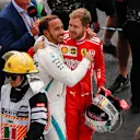 AUTODROMO HERMANOS RODRIGUEZ, MEXICO - OCTOBER 28: Title rival Sebastian Vettel, Ferrari, offers his congratulations to drivers championship winner Lewis Hamilton, Mercedes AMG F1 during the Mexican GP at Autodromo Hermanos Rodriguez on October 28, 2018 in Autodromo Hermanos Rodriguez, Mexico. (Photo by Joe Portlock / LAT Images)