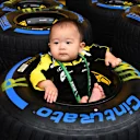 SUZUKA, JAPAN - OCTOBER 04: Young Renault Sport F1 Team fan and Pirelli tyre during the Japanese GP at Suzuka on October 04, 2018 in Suzuka, Japan. (Photo by Mark Sutton / Sutton Images)