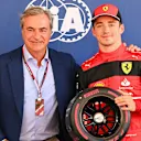 CIRCUIT DE BARCELONA-CATALUNYA, SPAIN - MAY 21: Charles Leclerc, Ferrari, receives his Pirelli pole position award from Carlos Sainz Snr during the Spanish GP at Circuit de Barcelona-Catalunya on Saturday May 21, 2022 in Barcelona, Spain. (Photo by Mark Sutton / LAT Images)