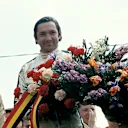 Pedro Rodriguez after his victory in the 1970 Belgian Grand Prix, sharing the podium with second and third placed Chris Amon and Jean-Pierre Beltoise (Photo by Bernard Cahier/Getty Images)