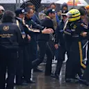 Ayrton Senna (Lotus Renault) is mobbed by Lotus team colleagues in parc ferme. Steve Hallam is wearing the yellow hat on the right of the picture. Copyright: LAT Photographic