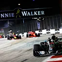 SINGAPORE STREET CIRCUIT, SINGAPORE - SEPTEMBER 16: Lewis Hamilton, Mercedes AMG F1 W09 EQ Power+, leads Max Verstappen, Red Bull Racing RB14, and Sebastian Vettel, Ferrari SF71H, at the start of the race during the Singapore GP at Singapore Street Circuit on September 16, 2018 in Singapore Street Circuit, Singapore. (Photo by Sam Bloxham / LAT Images)
