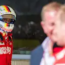 CIRCUIT OF THE AMERICAS, UNITED STATES OF AMERICA - OCTOBER 21: Sebastian Vettel, Ferrari, looks over as Kimi Raikkonen, Ferrari, 1st position, is interviewed by Martin Brundle, Sky Sports F1 during the United States GP at Circuit of the Americas on October 21, 2018 in Circuit of the Americas, United States of America. (Photo by Sam Bloxham / LAT Images)
