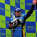 Race winner Fernando Alonso (ESP) Renault waves to the crowd from the podium.
Formula One World Championship, Rd 6, Spanish Grand Prix, Race, Barcelona, Spain, 14 May 2006. 