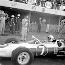 John Surtees (Ferrari 158) becomes the only man to win World Championships on motorbikes and in a car. 1964 Mexican Grand Prix. Mexico City, Mexico, 25 October 1964. © LAT Photographic