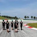 Sergio Perez (Force India) walks the track with members of his team. Malaysian Grand Prix, Preparations, Sepang, Malaysia, Thursday 26 March 2015. © Sutton Motorsport Images