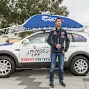 Daniel Ricciardo poses for a portrait infront of the chase car during the Daniel Ricciardo x Wings for Life World Run activation at the Botanical Gardens, Melbourne on March 10th, 2015 © Mark Dadswell for Wings for Life World Run
