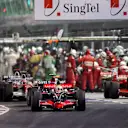Lewis Hamilton (GBR) McLaren Mercedes MP4/23 passes as Felipe Massa (BRA) Ferrari F2008 pulls over after a refuelling problem during his pitstop.
Formula One World Championship, Rd 15, Singapore Grand Prix, Race, Marina Bay Street Circuit, Singapore, Sunday 28 September 2008.

BEST IMAGE © © Sutton Motorsport Images