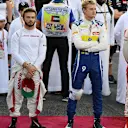 Roberto Merhi (ESP) Marussia, Will Stevens (GBR) Marussia, Marcus Ericsson (SWE) Sauber and Sebastian Vettel (GER) Ferrari on the grid at Formula One World Championship, Rd19, Abu Dhabi Grand Prix, Race, Yas Marina Circuit, Abu Dhabi, UAE, Sunday 29 November 2015. © Sutton Motorsport Images
