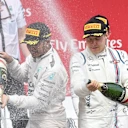 Race winner Lewis Hamilton (GBR) Mercedes AMG F1 and Valtteri Bottas (FIN) Williams  celebrate on the podium with the champagne at Formula One World Championship, Rd7, Canadian Grand Prix, Race, Montreal, Canada, Sunday 7 June 2015. © Sutton Motorsport Images