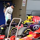 Pole sitter Lewis Hamilton (GBR) Mercedes AMG F1 looks at the Ferrari SF15-T in parc ferme at Formula One World Championship, Rd3, Chinese Grand Prix, Qualifying, Shanghai, China, Saturday 11 April 2015. © Sutton Motorsport Images