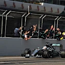 Race winner Lewis Hamilton (GBR) Mercedes AMG F1 W06 crosses the line and passes his team at Formula One World Championship, Rd3, Chinese Grand Prix, Race, Shanghai, China, Sunday 12 April 2015. © Sutton Motorsport Images