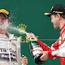 Sebastian Vettel (GER) Ferrari celebrates with Nico Rosberg (GER) Mercedes AMG F1 and champagne on the podium at Formula One World Championship, Rd3, Chinese Grand Prix, Race, Shanghai, China, Sunday 12 April 2015. © Sutton Motorsport Images