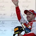 Sebastian Vettel (GER) Ferrari celebrates on the podium at Formula One World Championship, Rd14, Japanese Grand Prix, Race, Suzuka, Japan, Sunday 27 September 2015. © Sutton Motorsport Images