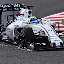 Felipe Massa (BRA) Williams FW37 with puncture on lap one at Formula One World Championship, Rd14, Japanese Grand Prix, Race, Suzuka, Japan, Sunday 27 September 2015. © Sutton Motorsport Images
