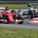 Sebastian Vettel (GER) Ferrari SF15-T leads Nico Rosberg (GER) Mercedes AMG F1 W06 at Formula One World Championship, Rd2, Malaysian Grand Prix, Race, Sepang, Malaysia, Sunday 29 March 2015. © Sutton Motorsport Images