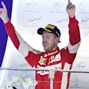 Race winner Sebastian Vettel (GER) Ferrari celebrates on the podium at Formula One World Championship, Rd13, Singapore Grand Prix, Race, Marina Bay Street Circuit, Singapore, Sunday 20 September 2015. © Sutton Motorsport Images