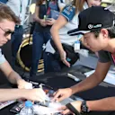 Daniil Kvyat (RUS) Scuderia Toro Rosso signs autographs for the fans at the drivers autograph session at Formula One World Championship, Rd21, Abu Dhabi Grand Prix, Qualifying, Yas Marina Circuit, Abu Dhabi, UAE, Saturday 26 November 2016. © Sutton Images