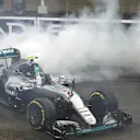 New World Champion Nico Rosberg (GER) Mercedes-Benz F1 W07 Hybrid celebrates at the end of the race with donuts at Formula One World Championship, Rd21, Abu Dhabi Grand Prix, Race, Yas Marina Circuit, Abu Dhabi, UAE, Sunday 27 November 2016. © Sutton Images