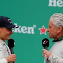 Valtteri Bottas (FIN) Williams and Michael Douglas (USA) Actor celebrate on the podium at Formula One World Championship, Rd7, Canadian Grand Prix, Race, Montreal, Canada, Sunday 12 June 2016. © Sutton Images