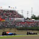 Jenson Button (GBR) McLaren MP4-31 and Pascal Wehrlein (GER) Manor Racing MRT05 at Formula One World Championship, Rd17, Japanese Grand Prix, Race, Suzuka, Japan, Sunday 9 October 2016. © Sutton Images