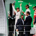 Tom Walton (GBR) Mercedes AMG F1 Engineer, Nico Rosberg (GER) Mercedes AMG F1, Lewis Hamilton (GBR) Mercedes AMG F1 and Sebastian Vettel (GER) Ferrari celebrate on the podium with the trophies at Formula One World Championship, Rd19, Mexican Grand Prix, Race, Circuit Hermanos Rodriguez, Mexico City, Mexico, Sunday 30 October 2016. © Sutton Images