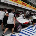 Haas VF-16 with Haas F1 mechanics in pit lane at Formula One World Championship, Rd15, Singapore Grand Prix, Qualifying, Marina Bay Street Circuit, Singapore, Saturday 17 September 2016. © Sutton Images