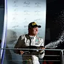 Race winner Nico Rosberg (GER) Mercedes AMG F1 celebrates on the podium with the champagne at Formula One World Championship, Rd15, Singapore Grand Prix, Race, Marina Bay Street Circuit, Singapore, Sunday 18 September 2016. © Sutton Images