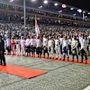 National Anthem is observed on the grid at Formula One World Championship, Rd15, Singapore Grand Prix, Race, Marina Bay Street Circuit, Singapore, Sunday 18 September 2016. © Sutton Images
