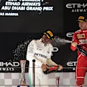 Lewis Hamilton (GBR) Mercedes AMG F1 and Sebastian Vettel (GER) Ferrari celebrate on the podium at Formula One World Championship, Rd20, Abu Dhabi Grand Prix, Race, Yas Marina Circuit, Abu Dhabi, UAE, Sunday 26 November 2017. © Manuel Goria/Sutton Images