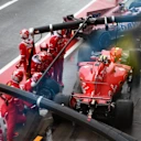 Kimi Raikkonen (FIN) Ferrari SF70-H pit stop and almost collides with Sergio Perez (MEX) Force India VJM10 at Formula One World Championship, Rd13, Italian Grand Prix, Qualifying, Monza, Italy, Saturday 2 September 2017. © Sutton Images