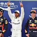 (L to R): Daniel Ricciardo (AUS) Red Bull Racing, pole sitter Lewis Hamilton (GBR) Mercedes AMG F1 and Max Verstappen (NED) Red Bull Racing celebrate in parc ferme at Formula One World Championship, Rd13, Italian Grand Prix, Qualifying, Monza, Italy, Satu
