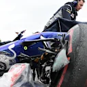The crashed car of Carlos Sainz (ESP) Scuderia Toro Rosso STR12 is recovered after FP1 at Formula One World Championship, Rd16, Japanese Grand Prix, Practice, Suzuka, Japan, Friday 6 October 2017. © Rubio/Sutton Images