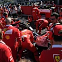 Ferrari mechanics observe the car of Sebastian Vettel (GER) Ferrari SF70-H on the grid with technical issues at Formula One World Championship, Rd16, Japanese Grand Prix, Race, Suzuka, Japan, Sunday 8 October 2017. © Mark Sutton/Sutton Images