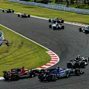 Marcus Ericsson (SWE) Sauber C36 and Fernando Alonso (ESP) McLaren MCL32 battle for position at the start of the race at Formula One World Championship, Rd16, Japanese Grand Prix, Race, Suzuka, Japan, Sunday 8 October 2017. © Kym Illman/Sutton Images