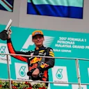 Race winner Max Verstappen (NED) Red Bull Racing celebrates on the podium with the trophy and champagne at Formula One World Championship, Rd15, Malaysian Grand Prix, Race, Sepang, Malaysia, Sunday 1 October 2017. © Kym Illman/Sutton Images
