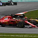 Sebastian Vettel (GER) Ferrari SF70-H and Nico Hulkenberg (GER) Renault Sport F1 Team RS17 battle at Formula One World Championship, Rd15, Malaysian Grand Prix, Race, Sepang, Malaysia, Sunday 1 October 2017. © Mark Sutton/Sutton Images