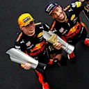 Race winner Max Verstappen (NED) Red Bull Racing and Daniel Ricciardo (AUS) Red Bull Racing celebrate on the podium with the trophies at Formula One World Championship, Rd15, Malaysian Grand Prix, Race, Sepang, Malaysia, Sunday 1 October 2017. © Mark Sutton/Sutton Images