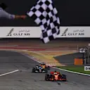 Race winner Sebastian Vettel (GER) Ferrari SF-71H crosses the line and takes the chequered flag at Formula One World Championship, Rd2, Bahrain Grand Prix, Race, Bahrain International Circuit, Sakhir, Bahrain, Sunday 8 April 2018.©Mark Sutton/Sutton Images