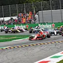 Kimi Raikkonen, Ferrari SF71H leads Sebastian Vettel, Ferrari SF71H and Lewis Hamilton, Mercedes AMG F1 W09 at the start of the race at Formula One World Championship, Rd14, Italian Grand Prix, Race, Monza, Italy, Sunday 2 September 2018. © Jerry Andre/Sutton Images