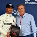 Pole sitter Lewis Hamilton (GBR) Mercedes-AMG F1 receives the Pirelli Pole Position Award from Carlos Sainz (ESP) at Formula One World Championship, Rd5, Spanish Grand Prix, Qualifying, Barcelona, Spain, Saturday 12 May 2018. © Mark Sutton/Sutton Images