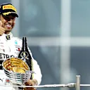 ABU DHABI, UNITED ARAB EMIRATES - DECEMBER 01: Race winner Lewis Hamilton of Great Britain and Mercedes GP celebrates on the podium during the F1 Grand Prix of Abu Dhabi at Yas Marina Circuit on December 01, 2019 in Abu Dhabi, United Arab Emirates. (Photo by Mark Thompson/Getty Images)