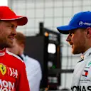 BAKU CITY CIRCUIT, AZERBAIJAN - APRIL 27: Sebastian Vettel, Ferrari, talks with pole man Valtteri Bottas, Mercedes AMG F1, after Qualifying during the Azerbaijan GP at Baku City Circuit on April 27, 2019 in Baku City Circuit, Azerbaijan. (Photo by Glenn Dunbar / LAT Images)