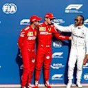 SPA-FRANCORCHAMPS, BELGIUM - AUGUST 31: Charles Leclerc, Ferrari, celebrates pole position, with Sebastian Vettel, Ferrari, and Lewis Hamilton, Mercedes AMG F1 during the Belgian GP at Spa-Francorchamps on August 31, 2019 in Spa-Francorchamps, Belgium. (Photo by Glenn Dunbar / LAT Images)