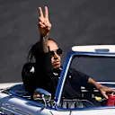 SUZUKA, JAPAN - OCTOBER 13: Lewis Hamilton of Great Britain and Mercedes GP waves to the crowd on the drivers parade before the F1 Grand Prix of Japan at Suzuka Circuit on October 13, 2019 in Suzuka, Japan. (Photo by Clive Mason/Getty Images)