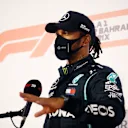 BAHRAIN, BAHRAIN - NOVEMBER 28: Pole position qualifier Lewis Hamilton of Great Britain and Mercedes GP talks to the media in parc ferme during qualifying ahead of the F1 Grand Prix of Bahrain at Bahrain International Circuit on November 28, 2020 in Bahrain, Bahrain. (Photo by Hamad Mohammed - Pool/Getty Images)