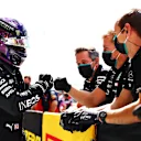 NORTHAMPTON, ENGLAND - AUGUST 01: Pole position qualifier Lewis Hamilton of Great Britain and Mercedes GP celebrates in parc ferme during qualifying for the F1 Grand Prix of Great Britain at Silverstone on August 01, 2020 in Northampton, England. (Photo by Dan Istitene - Formula 1/Formula 1 via Getty Images)