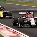 BUDAPEST, HUNGARY - JULY 19: Kimi Raikkonen of Finland driving the (7) Alfa Romeo Racing C39 Ferrari leads Esteban Ocon of France driving the (31) Renault Sport Formula One Team RS20 on track during the Formula One Grand Prix of Hungary at Hungaroring on July 19, 2020 in Budapest, Hungary. (Photo by Bryn Lennon/Getty Images)