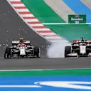 PORTIMAO, PORTUGAL - OCTOBER 25: Antonio Giovinazzi of Italy driving the (99) Alfa Romeo Racing C39 Ferrari and Romain Grosjean of France driving the (8) Haas F1 Team VF-20 Ferrari battle for position on track during the F1 Grand Prix of Portugal at Autodromo Internacional do Algarve on October 25, 2020 in Portimao, Portugal. (Photo by Jorge Guerrero - Pool/Getty Images)